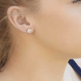 Gia Square 18ct Gold Stud Earrings On A Models Ears
