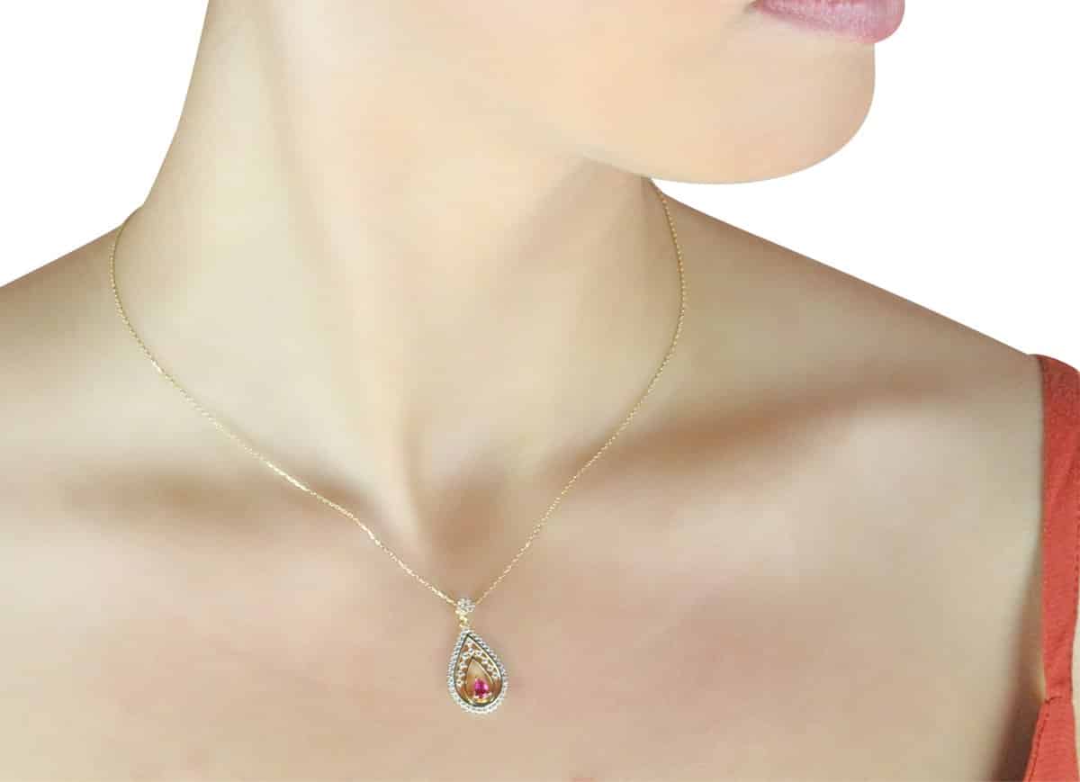 Aria Ruby 18ct Gold Pendant Necklace Around A Models Neck